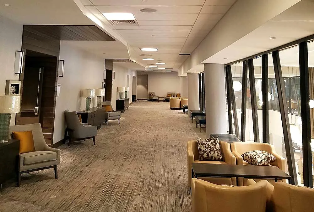 Illuminated commercial corridor with recessed LED lighting